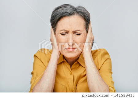 Headache, stress. Mature woman with headache touching hands on temples with suffering facial and eyes closed. Migraine Headache, stress. Mature woman with headache touching hands on temples with suffering facial and eyes closed. Migraine 141589435