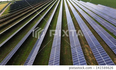 Solar farm generating clean power from photovoltaic panels, promoting renewable energy and sustainability concept Solar farm generating clean power from photovoltaic panels, promoting renewable energy and sustainability concept 141589826