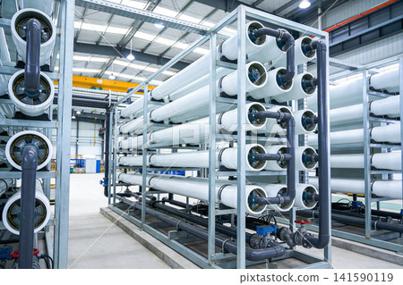 Industrial water filtration system with large white membrane housings and pipes Industrial water filtration system with large white membrane housings and pipes 141590119