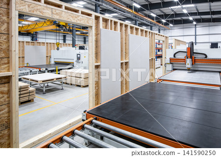 Modern manufacturing facility with automated machinery and construction materials Modern manufacturing facility with automated machinery and construction materials 141590250