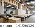 Modern factory producing prefabricated wooden wall elements on an assembly line 141590329