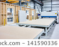 Modern factory interior with automated machinery for construction material production 141590336