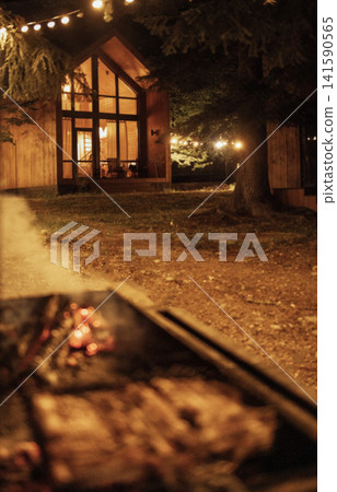 Close-up of an evening barbecue in the backyard of the house Close-up of an evening barbecue in the backyard of the house 141590565