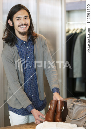 Male staff at an apparel shop Male staff at an apparel shop 141591290