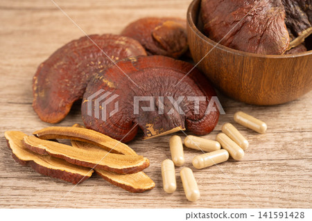 Lingzhi or Reishi mushroom with capsules, organic natural healthy food. 141591428