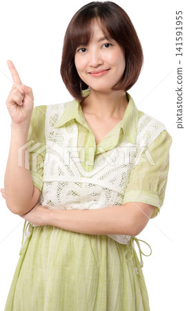 Cheerful asian woman points upward with confident smile, offering friendly suggestion Cheerful asian woman points upward with confident smile, offering friendly suggestion 141591955