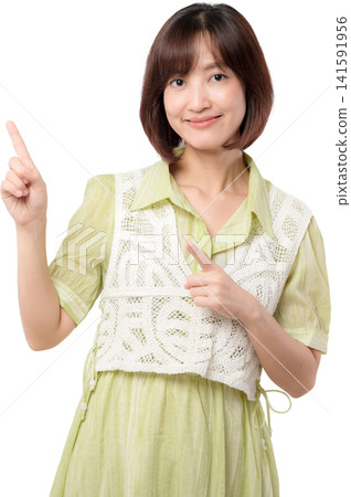 Young asian woman smiles, happy and cheerful, pointing. She offers great information, presenting service Young asian woman smiles, happy and cheerful, pointing. She offers great information, presenting service 141591956