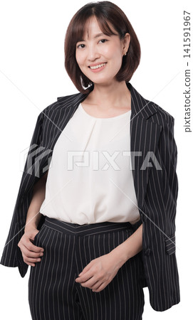 Joyful asian woman smiles confidently dressed smartly in modern corporate business fashion Joyful asian woman smiles confidently dressed smartly in modern corporate business fashion 141591967