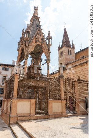 Gothic Scaliger Tomb with Equestrian Statue and Arched Canopy at antique Monument near cathedral Scaliger Santa Maria Antica church in old center city street. Verona Italy Gothic Scaliger Tomb with Equestrian Statue and Arched Canopy at antique Monument near cathedral Scaliger Santa Maria Antica church in old center city street. Verona Italy 141592018