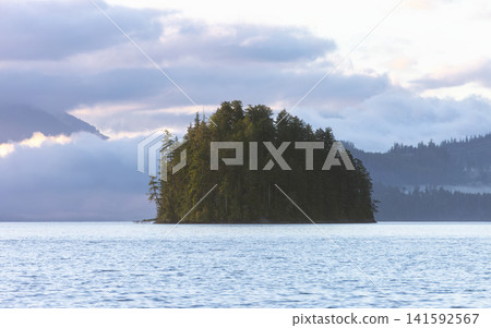 Fjord landscape at dusk with cloudy sky over mountains Fjord landscape at dusk with cloudy sky over mountains 141592567