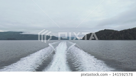 White foamy wake left by boat closeup 141592578