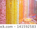 Bulk candy store display offering sweet gummy treats 141592583