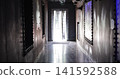 Dark mysterious hallway leading to bright light window 141592588
