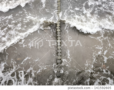 Coastal breakwaters resist the pressure of storm waves Coastal breakwaters resist the pressure of storm waves 141592605