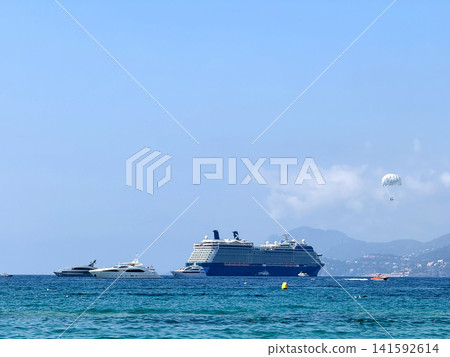 Luxury cruise ship sailing near Cannes coastline France Luxury cruise ship sailing near Cannes coastline France 141592614