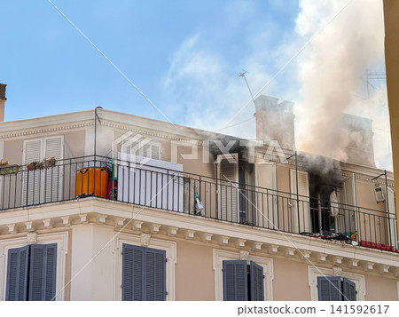 Close view of smoke above residential building Close view of smoke above residential building 141592617