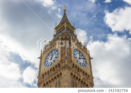 Big Ben clock tower against a cloudy blue sky in London 141592756