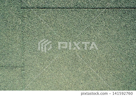 Granular green rubber crumb surface texture close up Granular green rubber crumb surface texture close up 141592760