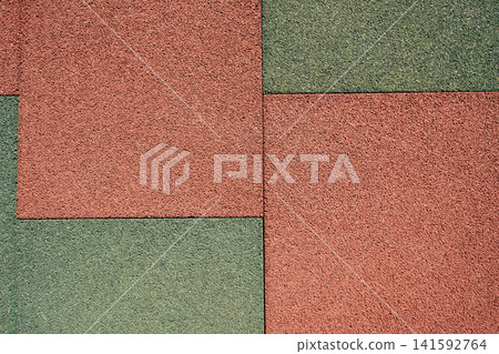 Aesthetic diagonal background of textured outdoor red rubber mat pavement, perfect for architectural Aesthetic diagonal background of textured outdoor red rubber mat pavement, perfect for architectural 141592764