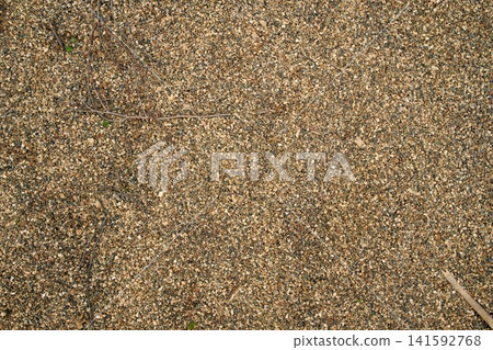Smooth uniform layer of bulk river sediment sand and aggregate, providing an authentic texture pattern for website layouts Smooth uniform layer of bulk river sediment sand and aggregate, providing an authentic texture pattern for website layouts 141592768