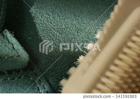 Macro silicone brush texture on sneaker edge, extreme closeup of white ridged head hovering over suede midsole, tactile detail, studio light Macro silicone brush texture on sneaker edge, extreme closeup of white ridged head hovering over suede midsole, tactile detail, studio light 141592803