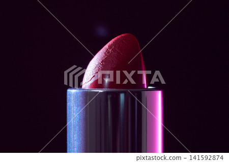 Closeup of vibrant magenta lips. High quality studio image showcasing vibrant lipstick with deep purple background for promotional use Closeup of vibrant magenta lips. High quality studio image showcasing vibrant lipstick with deep purple background for promotional use 141592874