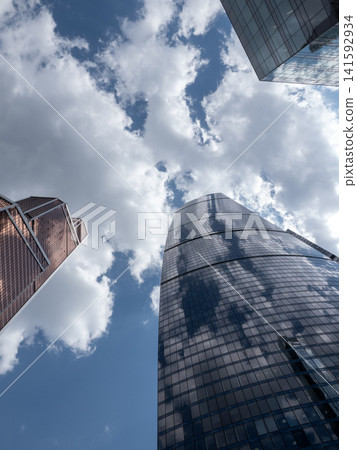 Modern high-rise buildings in Moscow city business district against the sky, urban architecture and contemporary cityscape Modern high-rise buildings in Moscow city business district against the sky, urban architecture and contemporary cityscape 141592934