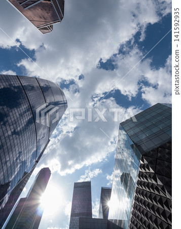 Modern high-rise buildings in Moscow city business district against the sky, urban architecture and contemporary cityscape Modern high-rise buildings in Moscow city business district against the sky, urban architecture and contemporary cityscape 141592935