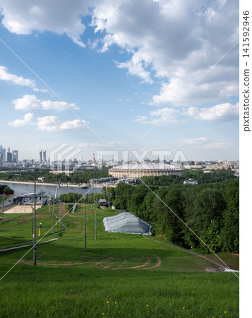 Panoramic view of Moscow urban landscape from Sparrow Hills with city buildings, skyline and clear sky Panoramic view of Moscow urban landscape from Sparrow Hills with city buildings, skyline and clear sky 141592946