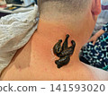 Medical leeches attaching to a person's neck during a hirudotherapy session, providing natural alternative treatment for various health conditions and promoting blood circulation. 141593020