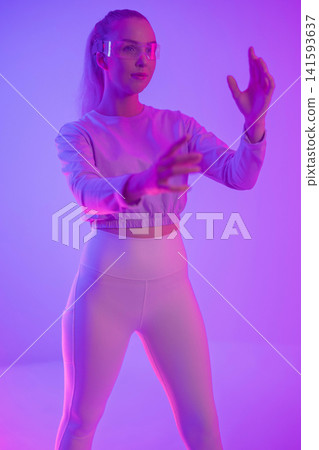 Woman in futuristic clothing and glasses Woman in futuristic clothing and glasses 141593637