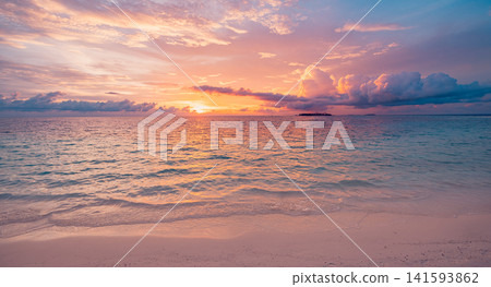 Breathtaking sunset over tropical ocean with glowing sun reflected on rippled water warm pastel sky. Perfect summer travel seascape paradise coastline. Peaceful luxury getaway scenic Breathtaking sunset over tropical ocean with glowing sun reflected on rippled water warm pastel sky. Perfect summer travel seascape paradise coastline. Peaceful luxury getaway scenic 141593862