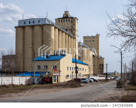 Barnaul Russia April 27 2026 Large concrete grain elevator building against the sky on a sunny day Barnaul Russia April 27 2026 Large concrete grain elevator building against the sky on a sunny day 141593899