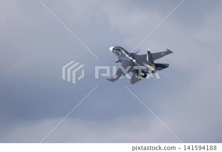 Russia Kubinka 12 April 2025. Su-30SM fighter jet performing aerobatics during an air show. Russian military aircraft executing complex maneuver with smoke trail against blue sky Russia Kubinka 12 April 2025. Su-30SM fighter jet performing aerobatics during an air show. Russian military aircraft executing complex maneuver with smoke trail against blue sky 141594188