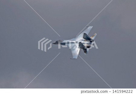Russia Kubinka 12 April 2025. Russian Knights aerobatic team performing on Su-35 fighter jets during an air show. Military aircraft in formation flight with smoke trails against blue sky Russia Kubinka 12 April 2025. Russian Knights aerobatic team performing on Su-35 fighter jets during an air show. Military aircraft in formation flight with smoke trails against blue sky 141594222