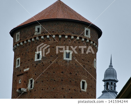 Krakow, Poland - August 6, 2023: Brick Facade of Wawel Senator Tower Krakow, Poland - August 6, 2023: Brick Facade of Wawel Senator Tower 141594244