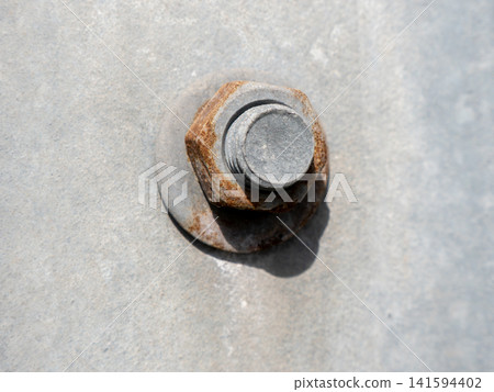 Large nut on metal pipe industrial close up mechanical connection plumbing and engineering detail concept. Large nut on metal pipe industrial close up mechanical connection plumbing and engineering detail concept. 141594402