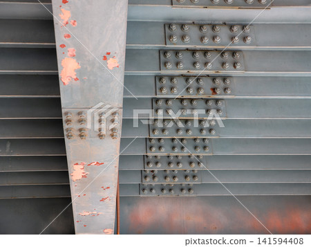 Close up of many metal nuts and bolts on bridge structure industrial engineering detail steel fasteners background. Close up of many metal nuts and bolts on bridge structure industrial engineering detail steel fasteners background. 141594408