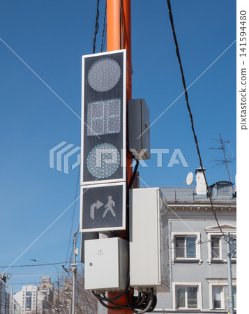 Green traffic light with pedestrian turn signal urban street safety and transport control. Green traffic light with pedestrian turn signal urban street safety and transport control. 141594480
