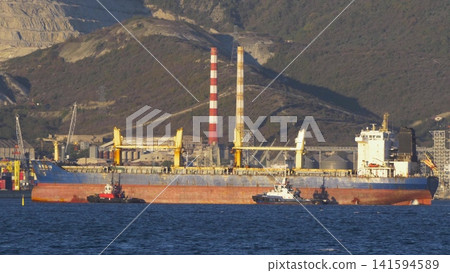 August 24, 2025: Large cargo ship entering the port of Novorossiysk, Russia, on the Black Sea, illustrating maritime transport, industrial shipping and coastal infrastructure 141594589