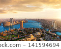 Panoramic bird's eye view of Cairo skyline at sunset with modern skyscrapers along the Nile river, Egypt 141594694