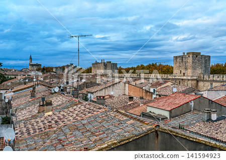 The houses of the historic city center of Aigues-Mortes in France, Occitanie, Gard seen from above the medieval walls The houses of the historic city center of Aigues-Mortes in France, Occitanie, Gard seen from above the medieval walls 141594923