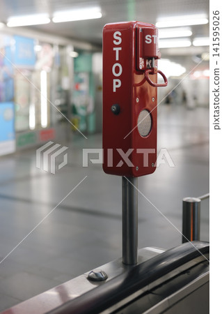 Emergency stop system on an escalator in a subway station illustrating the technical reliability of safety equipment. Emergency stop system on an escalator in a subway station illustrating the technical reliability of safety equipment. 141595026