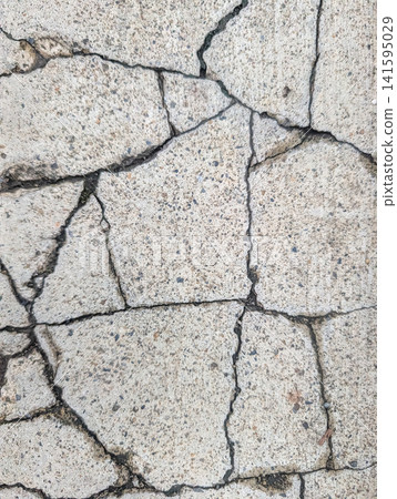 Cracked concrete pavement texture background material | Realistic cracks that represent aging and deterioration Cracked concrete pavement texture background material | Realistic cracks that represent aging and deterioration 141595029