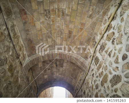 Ancient brick vaulted archway viewed from below in a stone tunnel setting Ancient brick vaulted archway viewed from below in a stone tunnel setting 141595263