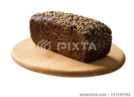 loaf wholemeal rye bread with sunflower seeds on cutting board, isolated on white background. loaf wholemeal rye bread with sunflower seeds on cutting board, isolated on white background. 141595362