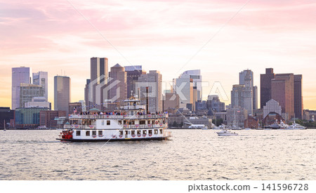 Boston skyline at sunset with a passenger ship on the foreground, USA Boston skyline at sunset with a passenger ship on the foreground, USA 141596728