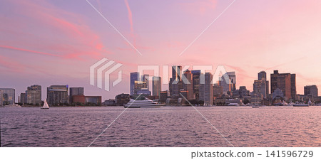 Boston illuminated skyline after the sunset with pink strips clouds, USA Boston illuminated skyline after the sunset with pink strips clouds, USA 141596729