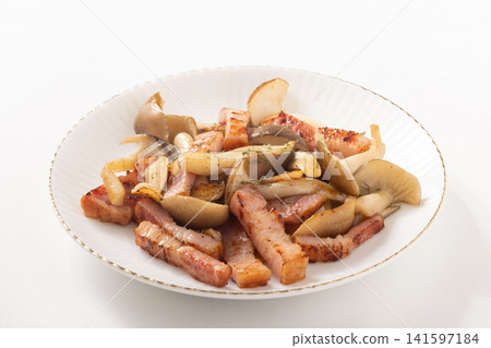 Bacon and large buna shimeji mushrooms stir-fried in butter and soy sauce. Bacon and large buna shimeji mushrooms stir-fried in butter and soy sauce. 141597184