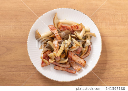 Bacon and large buna shimeji mushrooms stir-fried in butter and soy sauce. Bacon and large buna shimeji mushrooms stir-fried in butter and soy sauce. 141597188